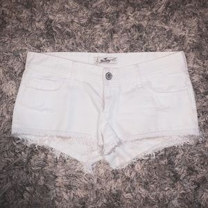 White hollister denim shorts with fringe